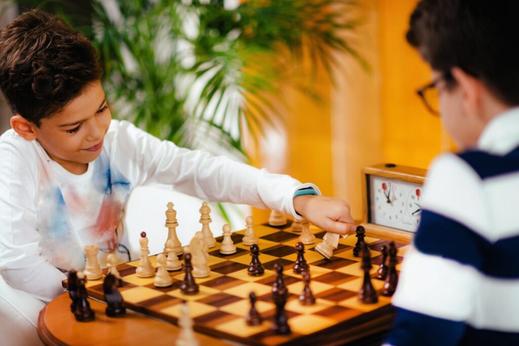 school-boys-playing-chess-e1650355412798.jpg
